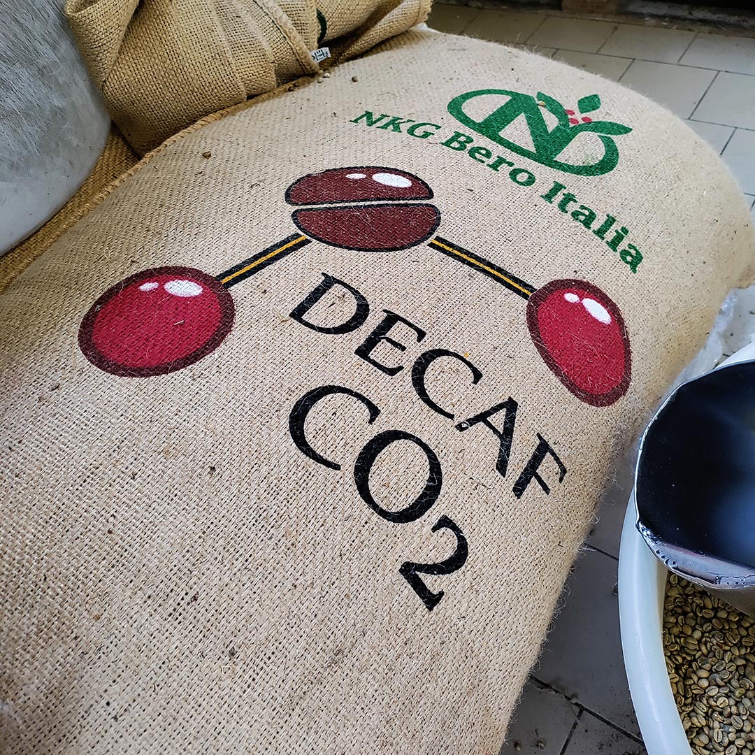 Manaresi decaffeinated coffeeThe jute bag with green coffee decaffeinated with water and carbon dioxide (CO<sub>2</sub>) in our raw coffee storage room waiting to be blended and roasted (torrefatto)
