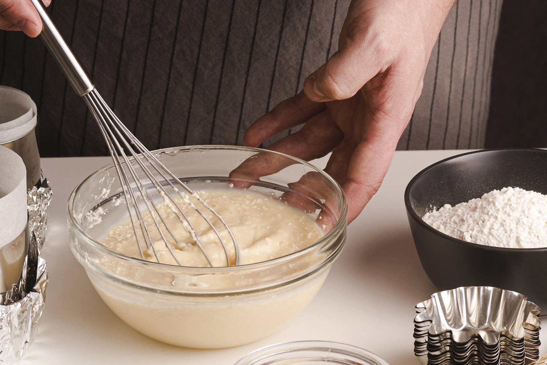 The quality of the ingredients, like the mascarpone shown in the photo, is the secret ingredient for a superior tiramisu